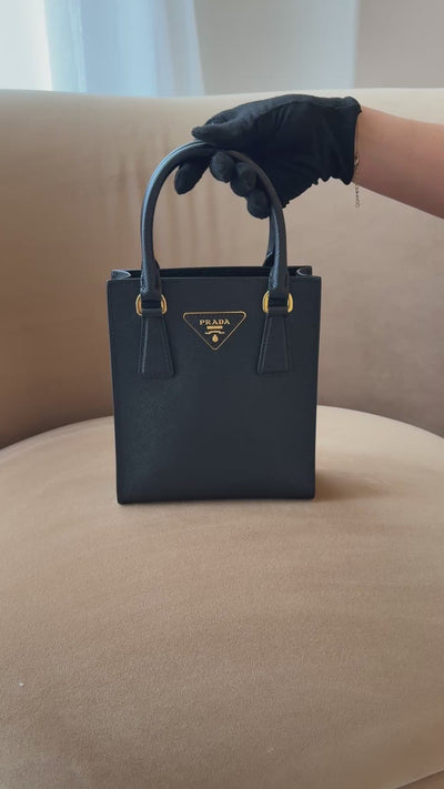 Prada Mini Tote In Black Saffiano Leather With Gold Hardware. 100% Authentic and preloved in excellent condition
