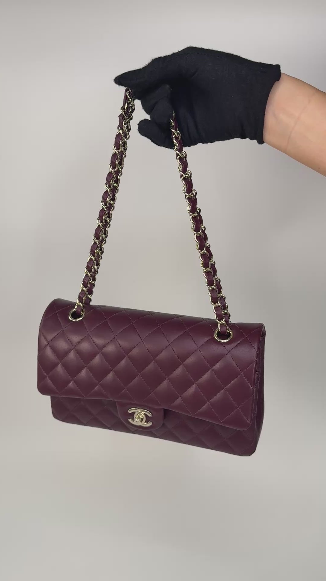 Chanel Medium Classic Double Flap Burgundy Lambskin Leather With Pale Gold Hardware. Authentic and preloved in excellent condition with 100% authenticity guarantee.