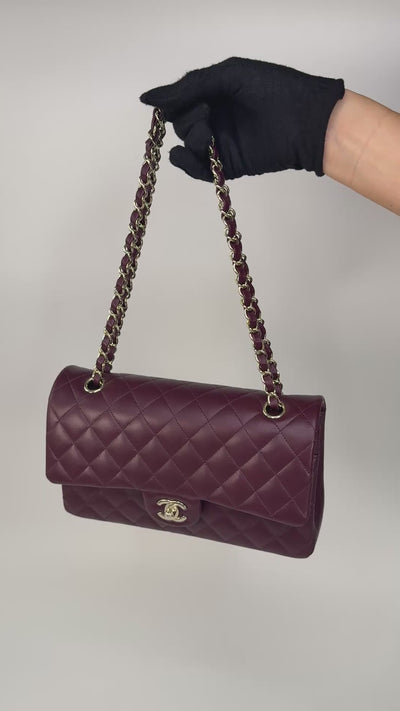 Chanel Medium Classic Double Flap Burgundy Lambskin Leather With Pale Gold Hardware. Authentic and preloved in excellent condition with 100% authenticity guarantee.