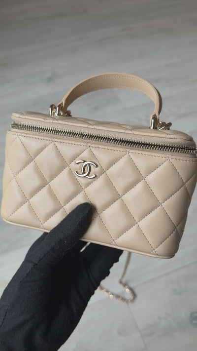 Chanel Mini Vanity Top Handle In Light Beige Lambskin Leather With Gold Hardware. Authentic and preloved in excellent condition. Insured next day delivery. Verified by Luxe Cheshire