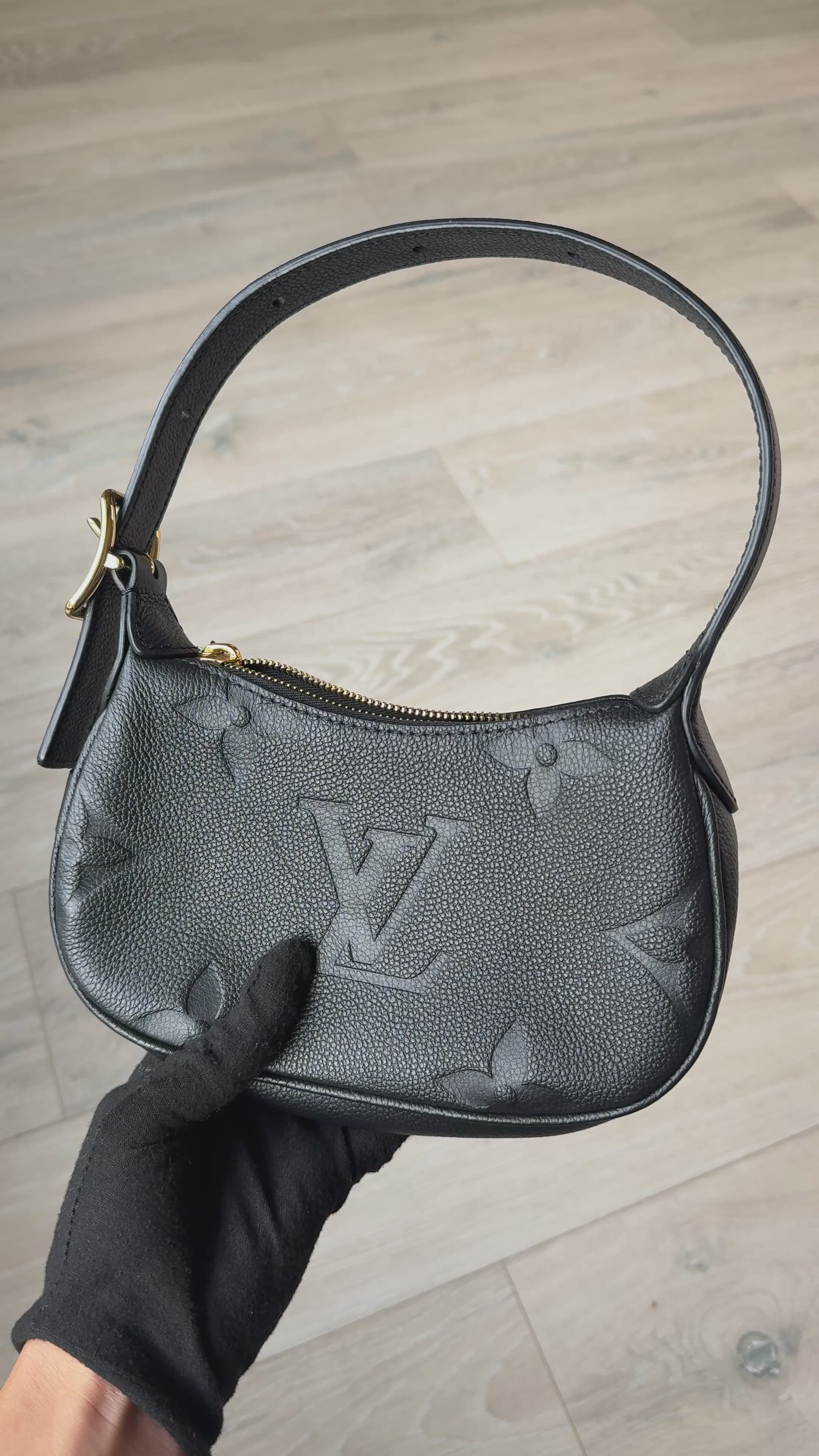 Louis Vuitton Mini Moon Bag In Black Leather With Gold Hardware in excellent condition 100% authentic and preloved