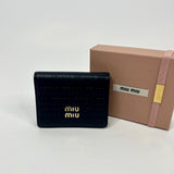 Miu Miu Embossed Monogram bi-fold Wallet